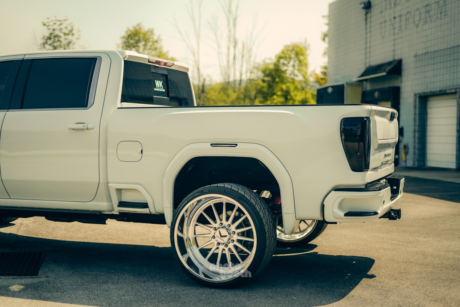 Rear detail of a white custom GMC truck